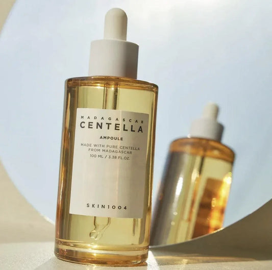 SKIN1004 Madagascar Centella Ampoule 100ml bottle in sunlight with its reflection, the lead product in the range